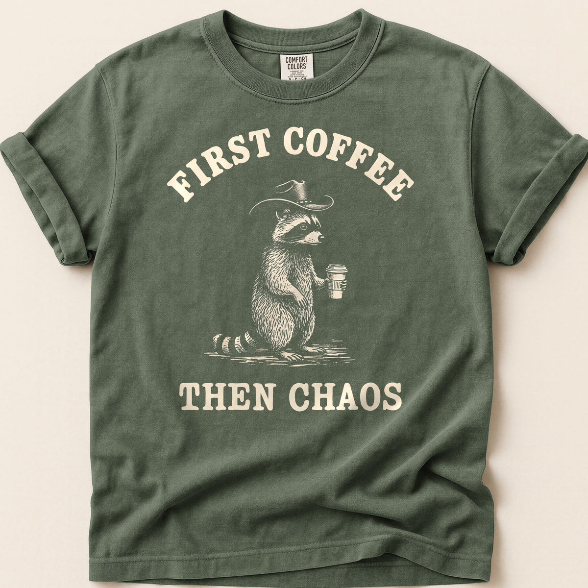 Coffee Chaos Raccoon T-shirt on Moss