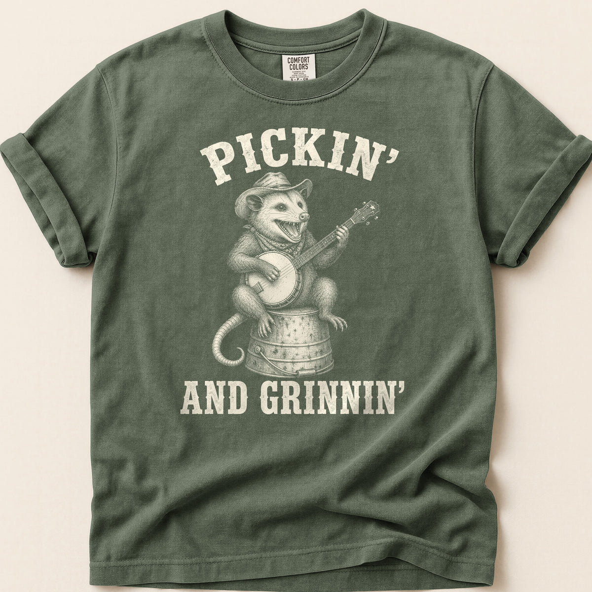 Pickin And Grinnin Possum T-shirt on Moss