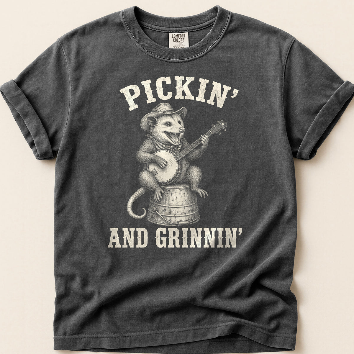 Pickin And Grinnin Possum T-shirt on Pepper